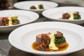A chef-made plate of steak and reductions.